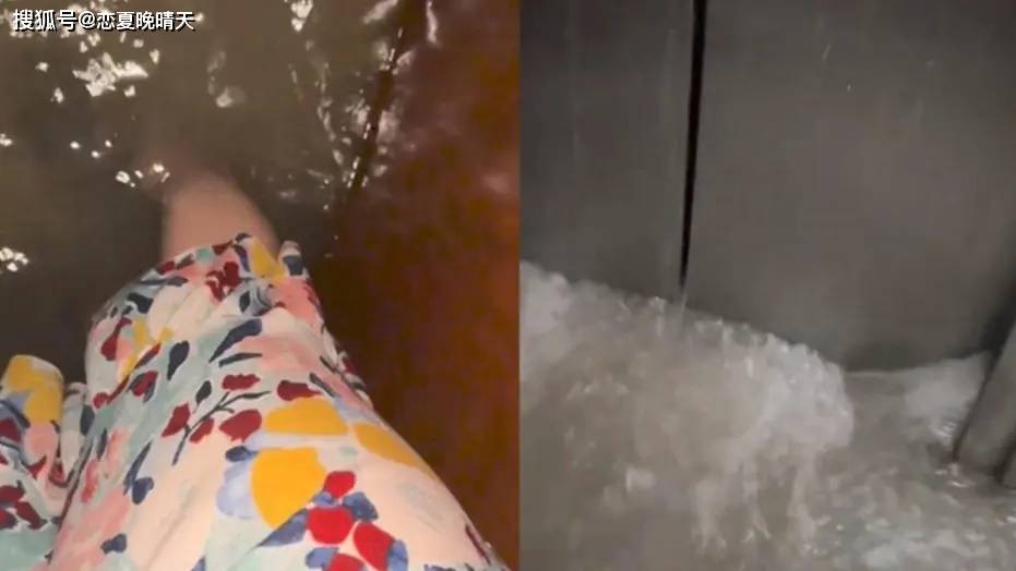 母女乘电梯暴雨涌入 水深到腿部-电梯妈妈托举孩子