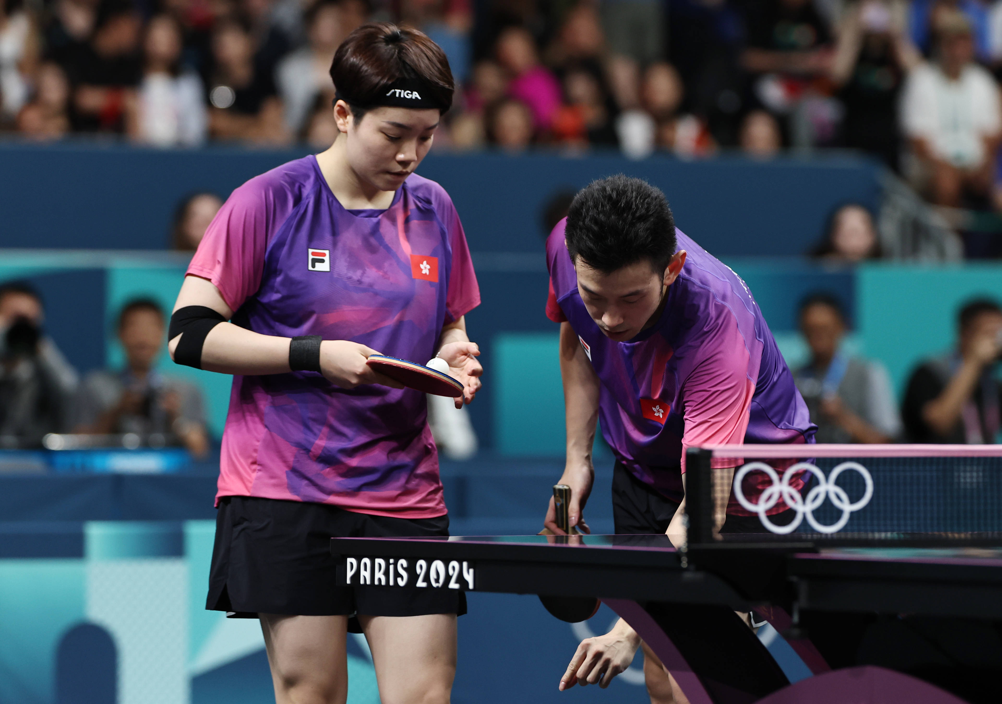 新华社照片,巴黎,2024年7月30日7月30日,黄镇廷/杜凯琹(左)在比赛中.